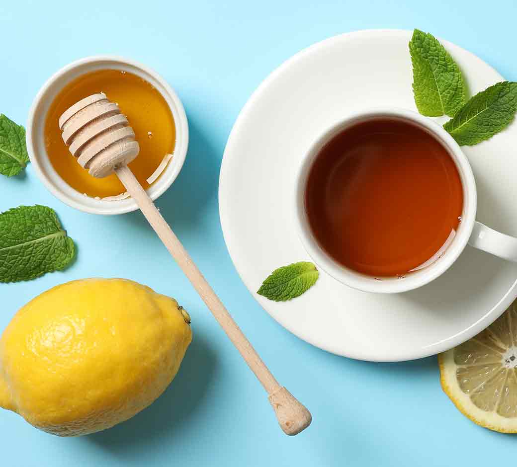 Hot tea, honey, ginger root and lemon