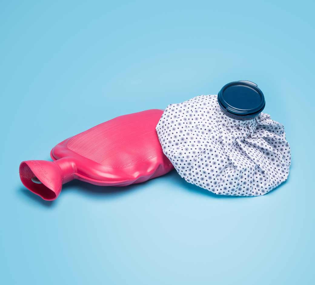 Image of heat pack and ice pack on blue background