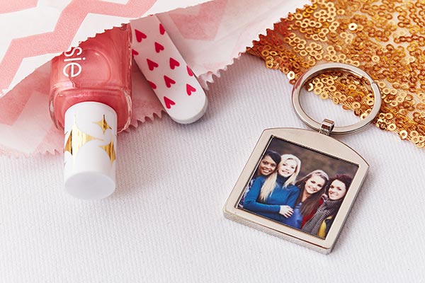 Photo keychain as a party favor along with nail polish and a nail file