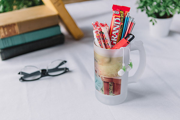 Frosted Photo Stein filled with candy, stylus pens, and a flash drive