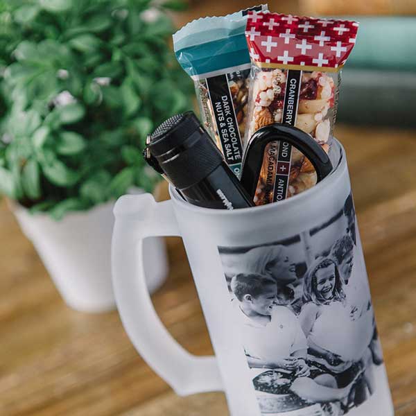 Frosted Photo Stein filled with a mini flashlight, granola bars and a carabineer clip