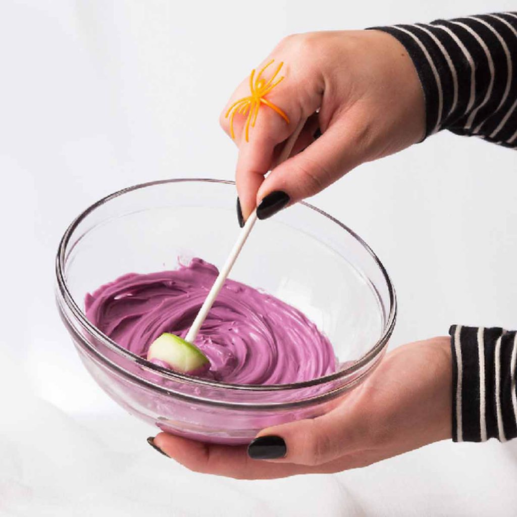 Dip fruit into dyed yogurts
