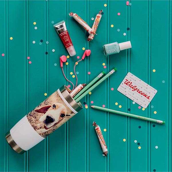 Personalized 14 oz. Travel Tumbler with photo of a dog, plus neutrogena lip gloss, Nice! Smarties candy, essie nail polish, hot pink ear buds, pencils and Walgreens gift card.