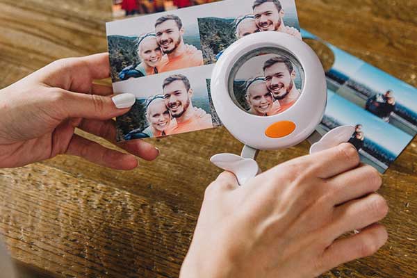 Cutting out photo of a couple with circular 2-inch punch